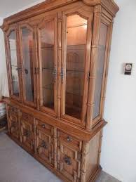 Lighted and mirrored curio cabinet. Absolute Auction Realty
