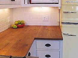 The detail of the tiles only comes out with close. Reclaimed Wood Fireplace Mantels Tables And Countertops Wood Countertops Reclaimed Wood Counter Reclaimed Wood Countertop