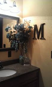 The beautiful backsplash has a mixture of brown tones that add dimension and texture to the focal wall. Teal And Yellow Bathroom Decor Love It Yellow Bathroom Decor Brown Bathroom Decor Blue Bathroom Decor