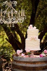 Wedding Cake Display On Top Of Wine Barrel Dotted With Pink Flowers Barrel Wedding Cake Wedding Wine Table Barrel Wedding Cake Table