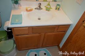 5 838 просмотров 5,8 тыс. Thrifty Artsy Girl Builders Grade Teal Bathroom Vanity And Faucet Upgrade For Only 60