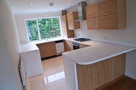 Small Wooden U Shaped Kitchen With Chic Look Beautiful Natural Wood Apliances With White Countertop A Kitchen Layout Kitchen Design Small Modern Kitchen Design