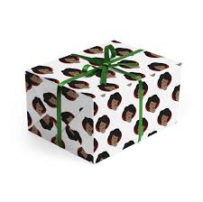 A fun family tradition is wrapping gifts for friends. Prepare For The Holidays With These Black Centric Adornments Essence