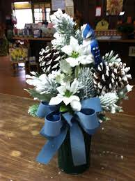 While there's a lot to think about when choosing flowers to place on a grave. Blue And White Winter Cemetery Can Flower Decorations Winter Flower Arrangements Christmas Floral