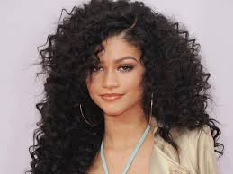 Long and thin face shape should let hair grow a little longer on the sides to create roundness, as seen here. Best Haircut Ideas For Curly Hair Teen Vogue