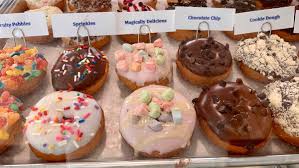 The donuts are hot and the toppings are added when you order them. Choose From 60 Different Kinds Of Delicious Made To Order Doughnuts At This New Hyde Park Store