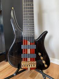 These pics just don't do this bass justice. This beautiful 6-string Surine  Quest NTVII is the result of several back-and-forth conversations with our  good friend and customer, Lawrence Killings. The solid Ebony