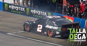 In this video brad keselowski's pit stop doesn't go according to plan as he over shoots the stall and ends up hitting his crew members! Brad Keselowski Spins On Talladega Pit Road Lands In Box Nascar Com