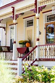 Decorating with fall lanterns will add the perfect ambiance to your interior and exterior living spaces. Outdoor Fall Decorating Ideas To Inspire You Town Country Living Victorian Porch Fall Outdoor Decor House Exterior
