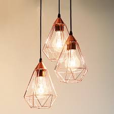 Using pendant lights is all about getting the right balance between the various elements that one uses and the texture of different surfaces in the kitchen. Glossy Copper Hanging Light Tarbes 3 Bulb Lights Co Uk