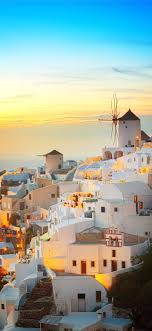 The Best Places To Watch The Sunset In Santorini Santorini 100mostbeautifulplacestovisit Greece Iphonexwallpaper Travel Wallpaper Greek Islands Travel