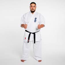 Borrowed from japanese 空(から)手(て) (karate), from 唐(から)手(て) (karate), from okinawan 唐手 (tūdī, chinese hand). Fujimae Karate Gi Kyokushin Training Weiss