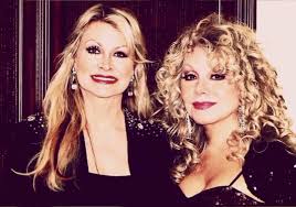 The total number of individual song titles she has recorded and released is 956. Dolly Parton Family A Singing And A Big One