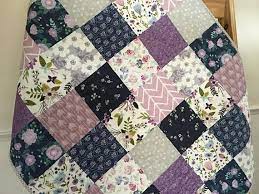 Beautiful Floral Baby Quilt In Navy And Lavender Featuring Floral And Modern Prints The Quilt Would Make An Excellent Baby Show Baby Quilts Floral Baby Quilts