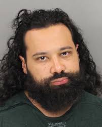 Suspect accused of impersonating police officer at The Battery