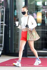 How 7 Celebrities Style Bike Shorts Differently Bella Hadid Outfits Bike Shorts Bike Shorts Outfit