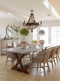 If you have dining room chairs that you like except for the color, check out how this dining room chair makeover that this blogger did. Light Uncluttered And Summery Cottage Dining Rooms Wicker Dining Chairs Dining Room Table