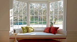 Modern bedroom with cinnamon maple hardwood floor white sofa under window. Bay Windows An Architect Explains Architecture Ideas