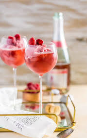 The complete drink recipe and how to make a mock pink champagne cocktail with cranberry juice, lemon lime soda, orange juice, pineapple juice, sugar, water. Raspberry Sorbet Pink Champagne Floats The Cookie Rookie