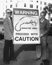 Florida Memory • Florida Dept. of Natural Resources director Harmon Shields,  right, and Clifford A. Willis with new manatee protection sign