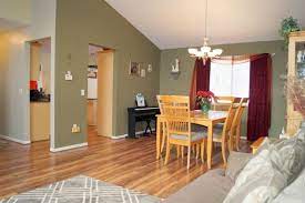 It is a perfect paint color for a guest bedroom. This Moss Green Paint Color Is A Beautiful Compliment To The Light Colored Floors And Furniture Adding A Pop Real Estate Real Estate Team Green Paint Colors