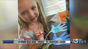 4 year old gives hugs to nursing home