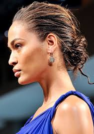 Model Spotted With The Wet Look And A Low Messy Bun This Hair Trend Can Really Suit Anything Wet Look Hair Chignon Hair Winter Hair Trends