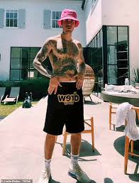 Maybe you would like to learn more about one of these? Justin Bieber Shows Off Tattoo Collection In Shirtless Tik Tok Video As He Dances In His Backyard Readsector