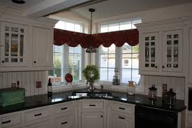 This combination offers easy access to all the shelves and their contents. Creative Corner Sink Window Solution American Traditional Kitchen Bridgeport By Dean Cabinetry
