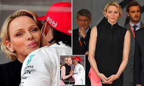 Princess charlene of monaco joins australian f1 driver daniel ricciardo after his red bull team clinched the top spot on the podium at the monaco princess charlene turned up the glamour for her second day at the monaco grand prix in a colourful striped look. Princess Charlene Of Monaco Receives Kiss From Lewis Hamilton My Lifestyle Max