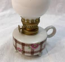 The design features blue swirled glass, frosted chimney shade and antique brass finished metal components. Small Vintage Porcelain Oil Lamp Yd 011 1120 00281 Estatesales Org