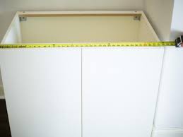 An open solution is perfect to keep your books and photos on display or to decorate with houseplants. Fake A Built In With Prefab Cabinets And Bookcases Hgtv