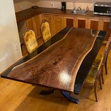 We started making river tables because we couldn't find a coffee table that we really wanted in our home. Walnut Reverse River Table With Black Epoxy 8 Long Lancaster Live Edge