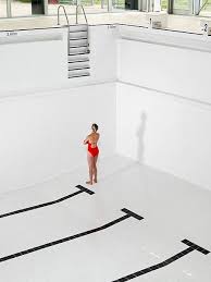 Woman Looks Up To Steps In Empty Pool Pool Photography Empty Pool Photography Inspiration Creative