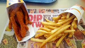 Burger king) the cheesy bacon double costs £6.89 and is essentially made up of two beef patties topped with tomato, onion , four slices of bacon, fresh lettuce, bbq sauce, cheese sauce and two oozy american cheese slices in the centre. Burger King Chicken Fries Avoiding Blowout