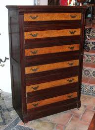The chest section hides four drawers and is placed on a slightly advanced socle. 1860s Six Drawer Dresser With Side Lock At 1stdibs
