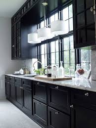 Classic Marble And Black Kinda Liken The Dark Cabinets And Window Trim Love The Island Chandelier O Kitchen Trends Kitchen Interior Black Kitchen Cabinets