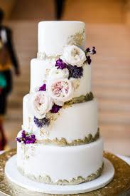 A three tier wedding cake in white with pearls and a burgundy band around the cake. 90 Showstopping Wedding Cake Ideas For Any Season Shutterfly