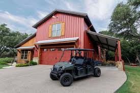 The lower level designed as garage and storage space utilizes a 16' wide overhead door. Custom Steel Living Spaces Barn Homes Mueller Inc