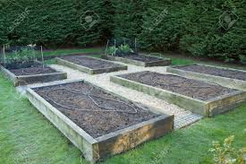 Measure the side of your raised bed, multiply that number by two, then add the width of your row cover to that. Maintaining A Vegetable Garden In Winter Empty Raised Beds In Stock Photo Picture And Royalty Free Image Image 156488835