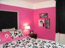 A purple and gold bench sits on a pink geometric rugat the foot of a white twin bed dressed in a pale pink duvet cover accented with pink pillows. Dramatic Black White Hot Pink Room On A Budget Hot Pink Room Hot Pink Bedrooms Pink Room