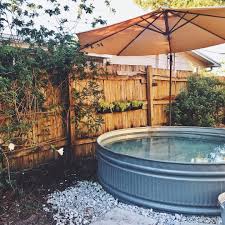 Give Yourself A Shady Space To Chill With A Patio Umbrella Mounted Over Your Stock Tank Pool Stock Tank Pool Diy Diy Stock Tank Tank Pool