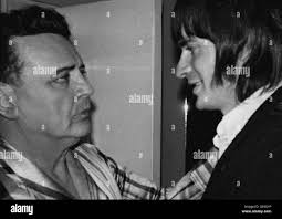 Who was shot in head in Black and White Stock Photos & Images