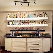 This floating wall shelf is the perfect pick for displaying accent pieces and your favorite reads. Basement Bar Ideas Liquor Bottle Storage Renee Romeo