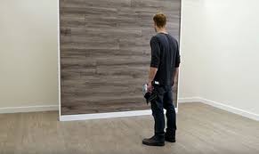 Laminate flooring would look great on the walls if you are using the right technique to install. Home Dzine Home Improvement Create A Feature Wall With Laminate Flooring