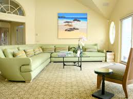 Choose a few green accents, such as pillows, throws, or artwork, to offset a palette of creams, grays, and browns. Couch Color For Olive Green Living Room Modern Architecture