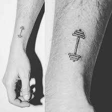 Workout Tattoos 40 Fitness Tattoos That Ll Make You Wanna Get Inked And Hit The Gym Fitness Tattoos Wrist Tattoos For Guys Tattoos