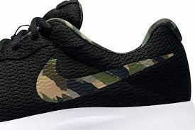 Nike Tanjun Premium sneakers in black | RunRepeat