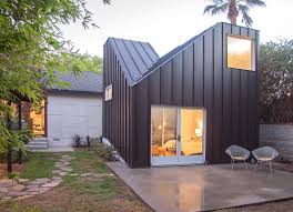 Casey Hughes Architects Adds Twin Peaked Extension To Refurbished La Home Architecture Standing Seam House Exterior