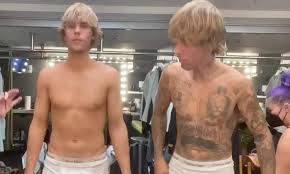 As we said last week, he appears to be going for a sleeve, as he added a koi fish check out this awesome infographic and tell us which bieber tattoo is your favorite. Justin Bieber Shows Off Tattoo Removal Process In A Pair Of White Briefs For Anyone Music Video Daily Mail Online